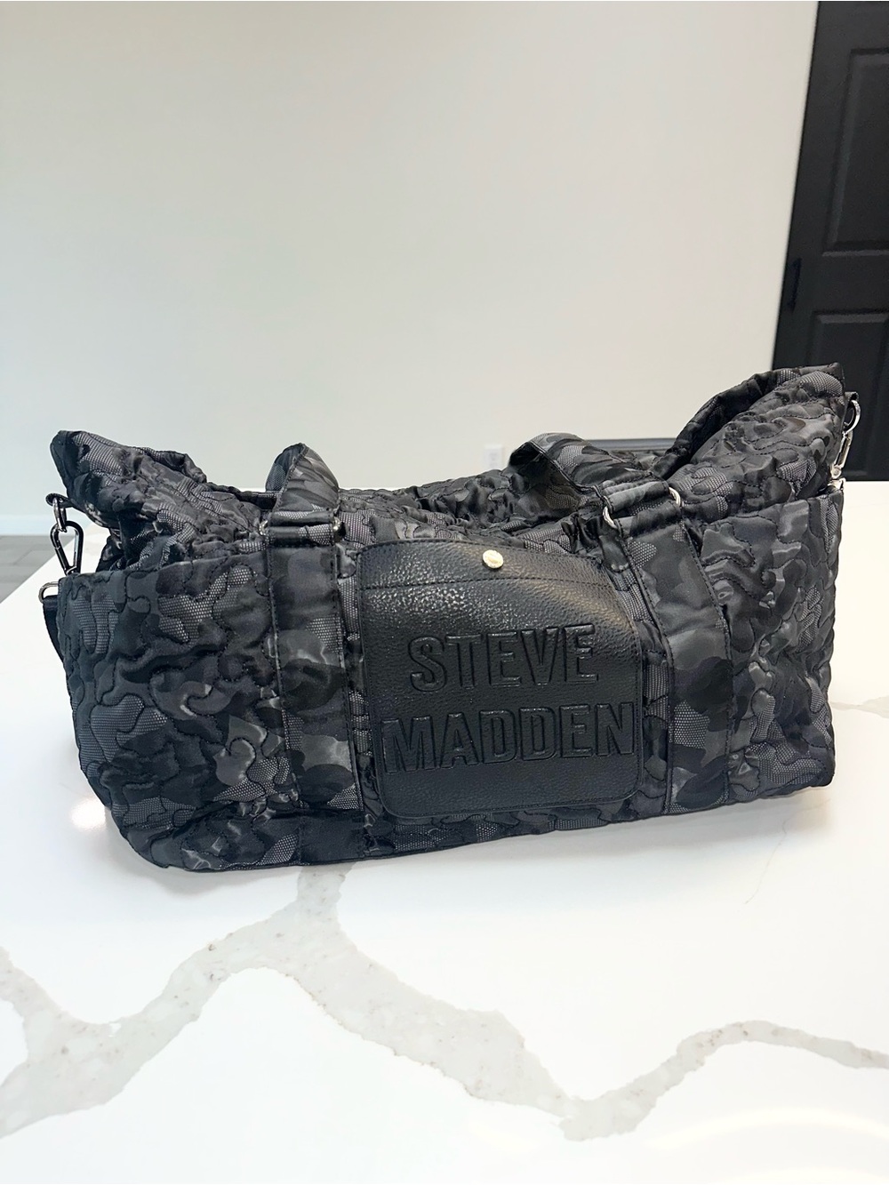 Steve Madden Black Quilted Camo Logo Duffel
